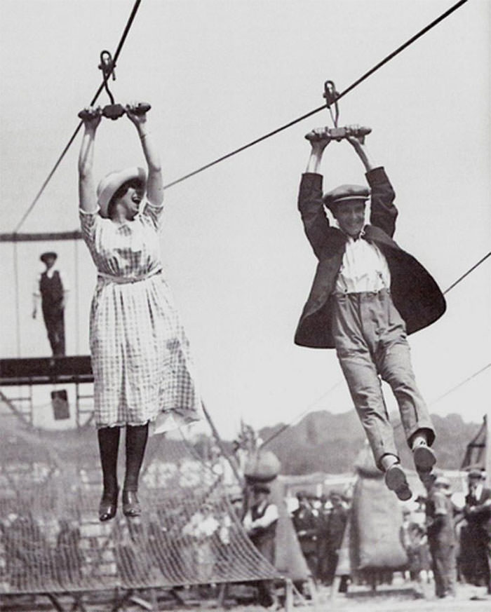 A couple enjoys an old-fashioned zipline, 1923