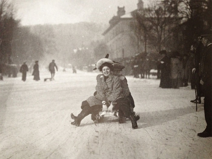 A young woman goes sledding at buxton in the english peak district, 1904