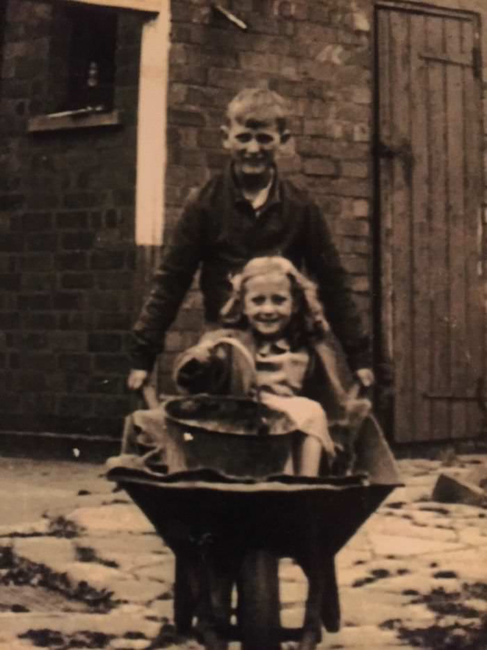 Taking his cousin for a wheelbarrow ride 1948 corley moor, u.k.