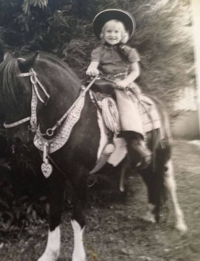 Having my picture taken by a traveling photographe with a horse 1965