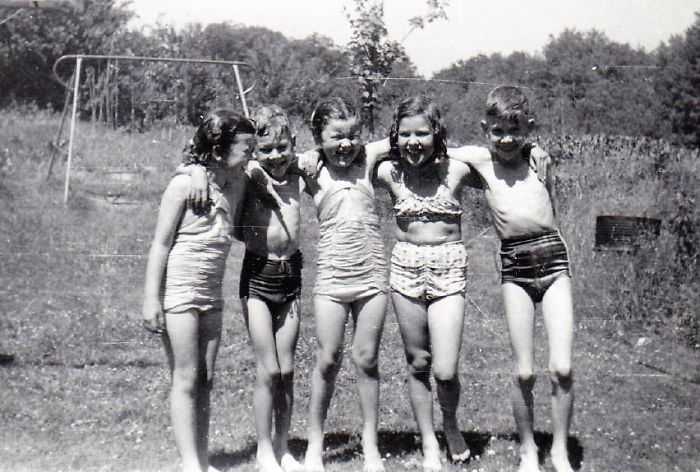 Summer fun in the sprinkler ..about 1950