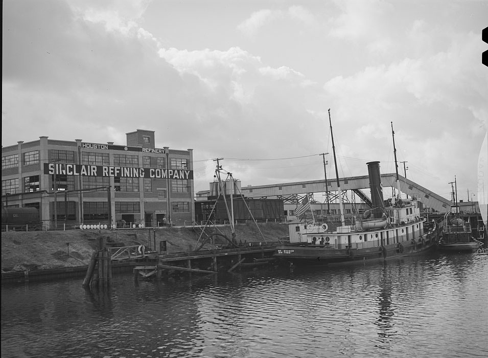 Tug at refinery dock. Port of Houston, Texas