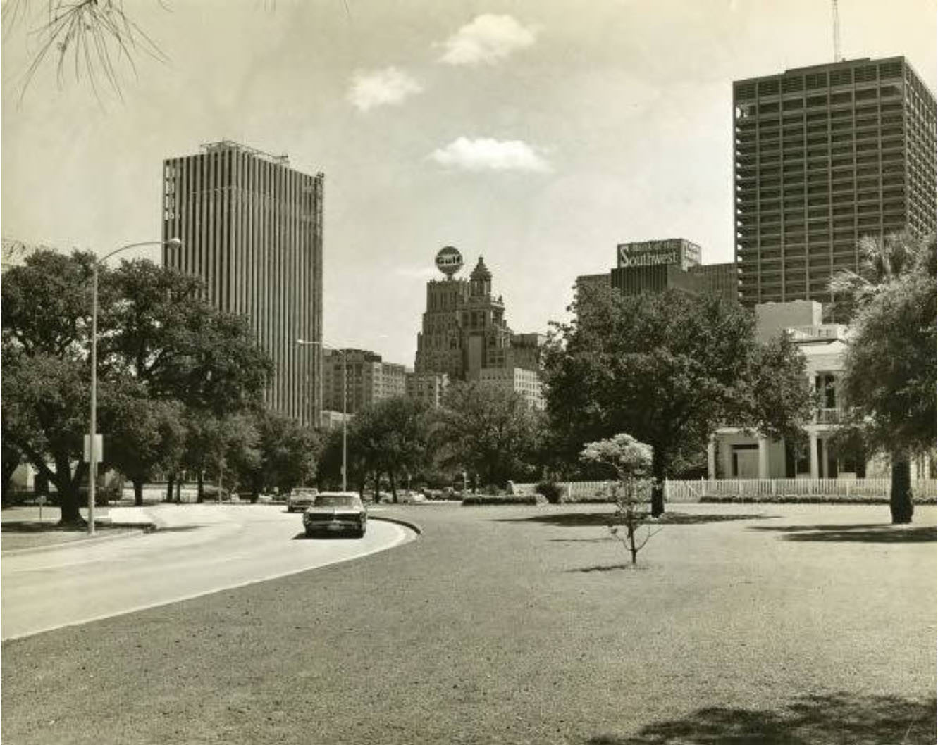 Memorial Drive, Houston skyline in the background.