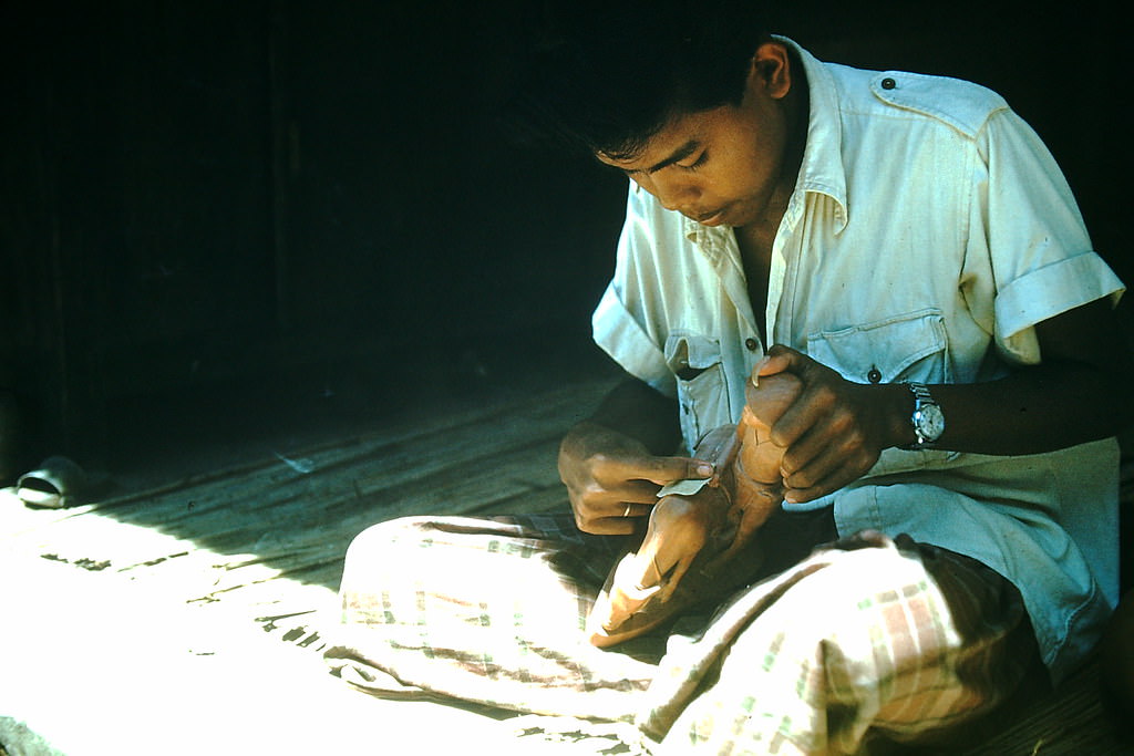 Polishing Wood Carving, Indonesia, 1952