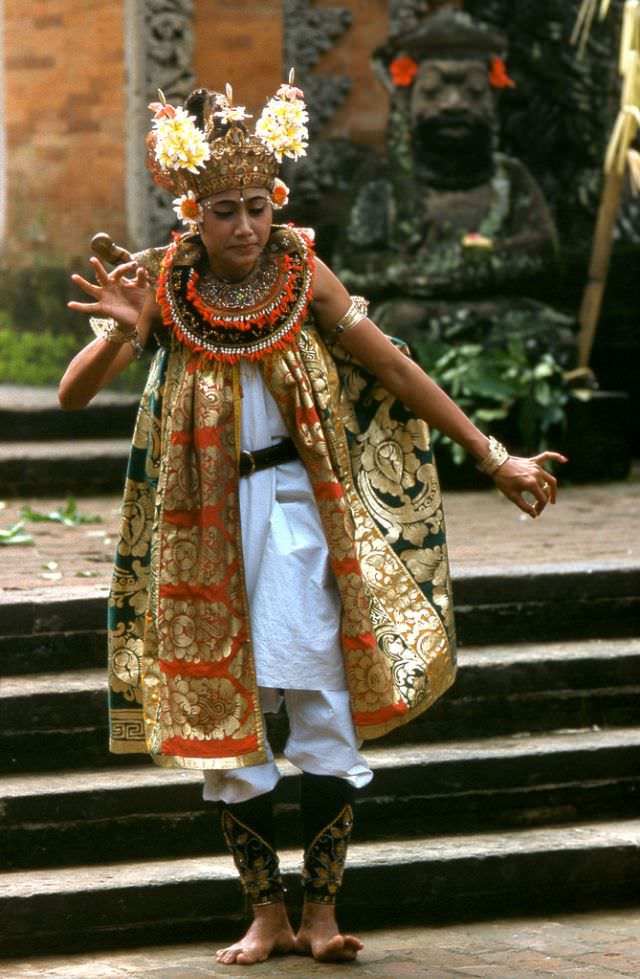 Colorful costume worn by a dancer performing a traditional dance at Kuta Beach, 1970s