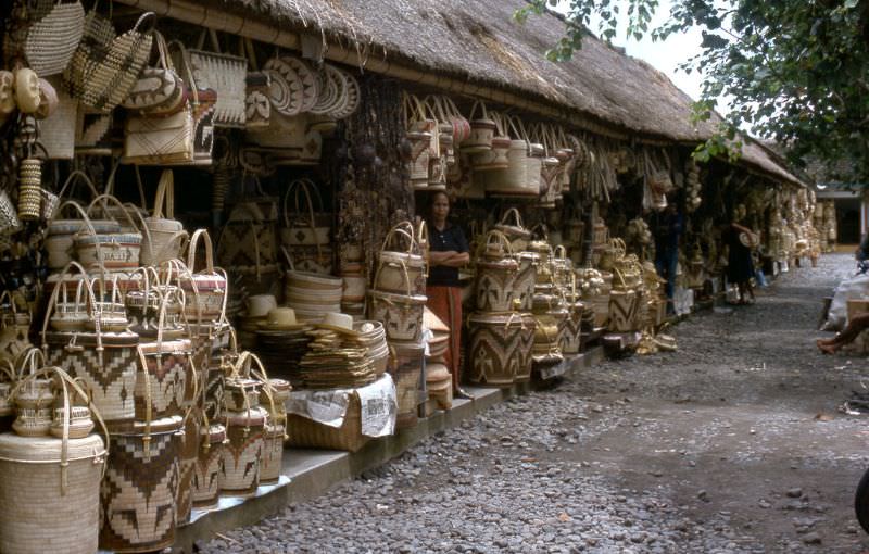 Vendor and baskets on a sidestreet at Kuta Beach, Bali, 1970s