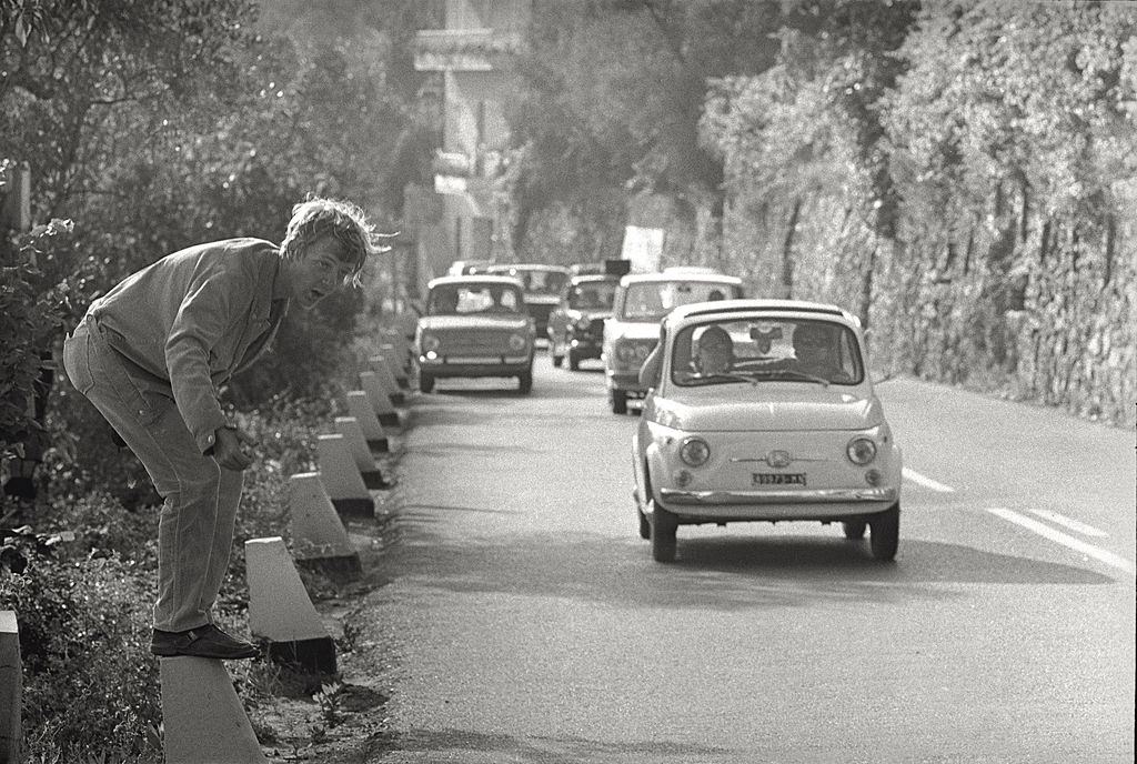 A young man hitchhiking in Chiavari, 1960.