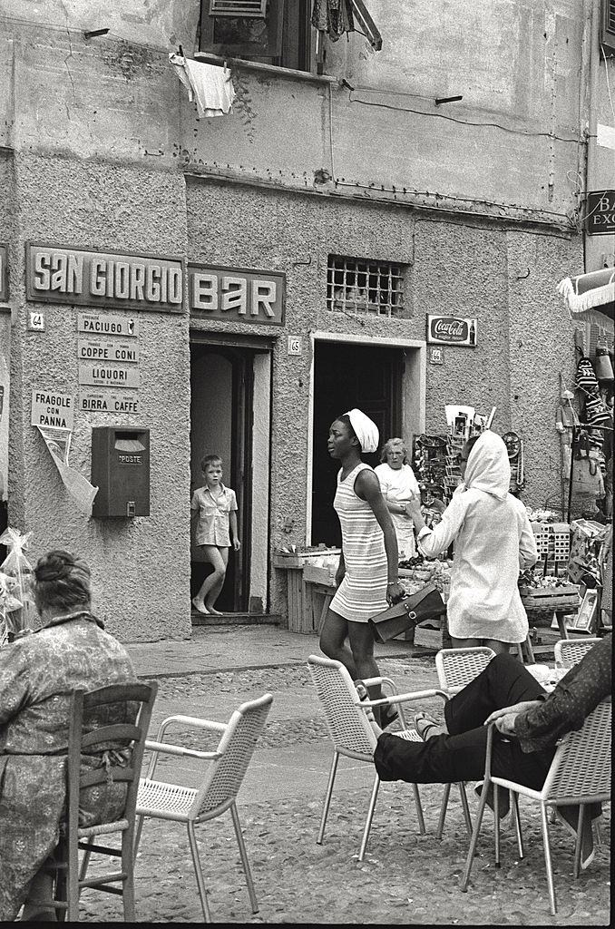 An African girl walking in Portofino, 1960s.