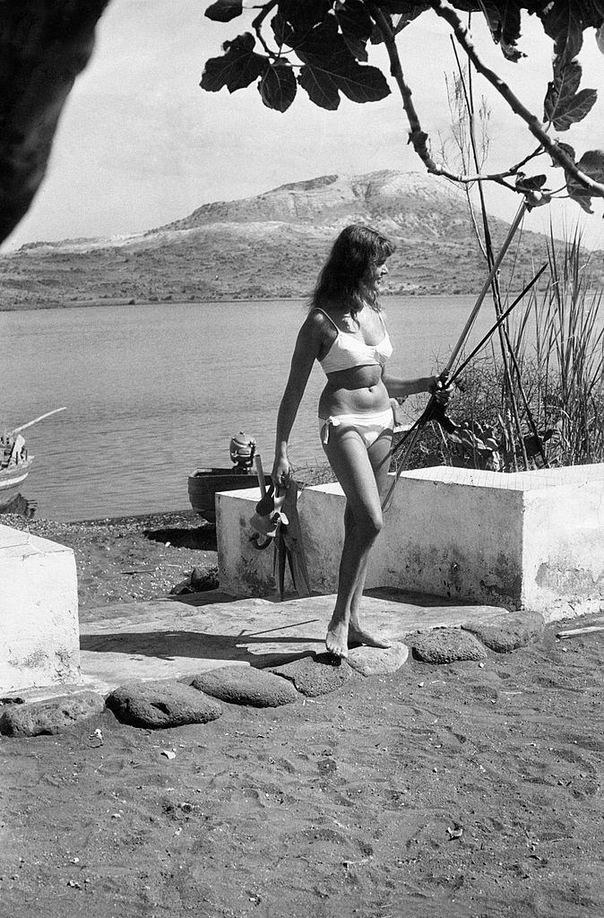 German tourist wearing a bikini in Vulcano Island, 1960.