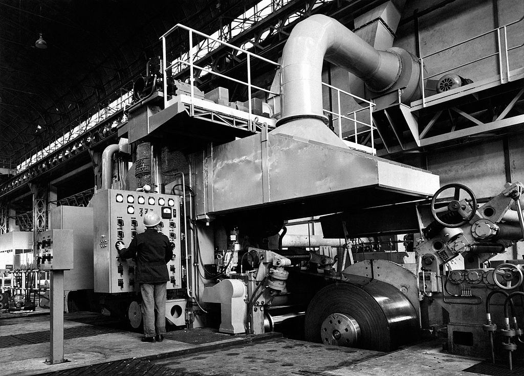 A worker working on the department of production of cold rolled section at Falk steel plant. Sesto San Giovanni, 1960s.