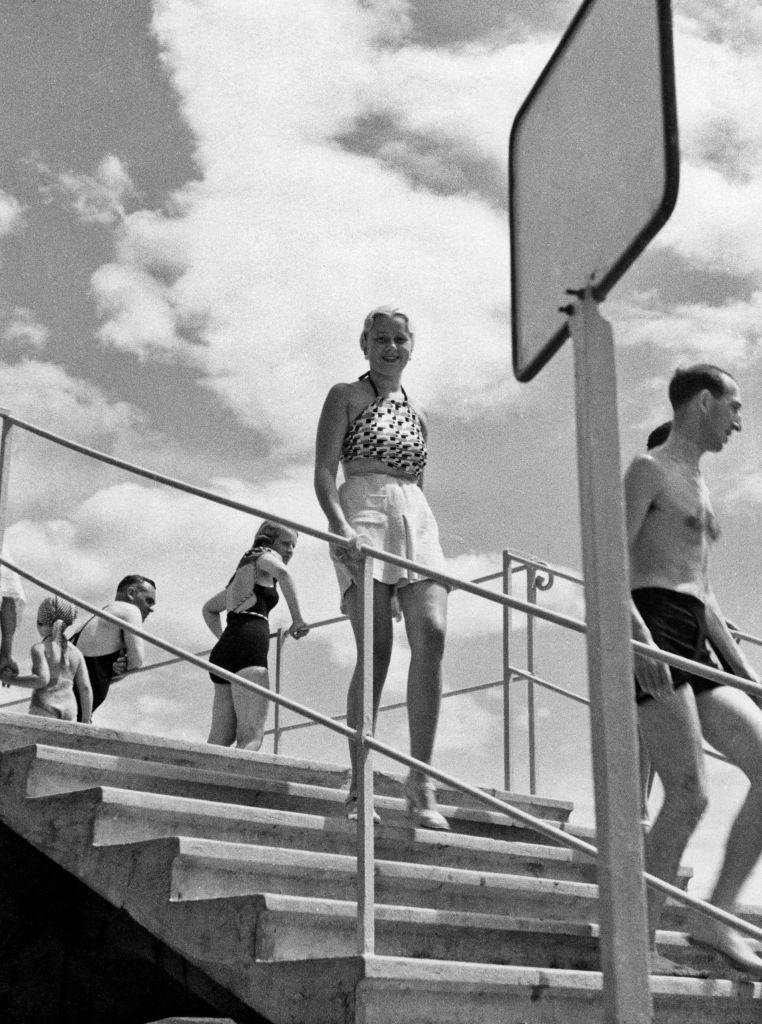 Some people going down the stairs of the lido Savoia in Opatija, Opatija, 1960s.