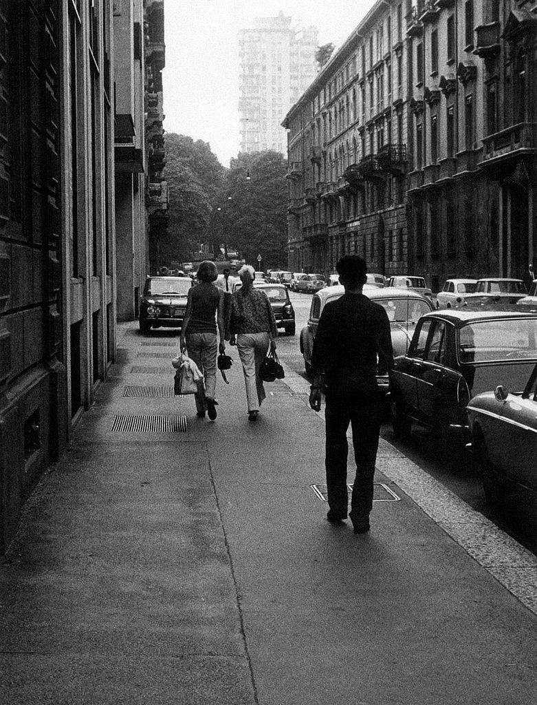 People walking in via Leopardi. Milan, 1960s.