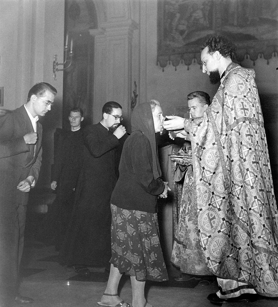 People attending a mass at the Russian Orthodox Church of Saint Nicholas Thaumaturgus. Rome, 1960s