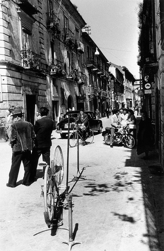 People standing and walking on via Appia. Capua, 1960s.