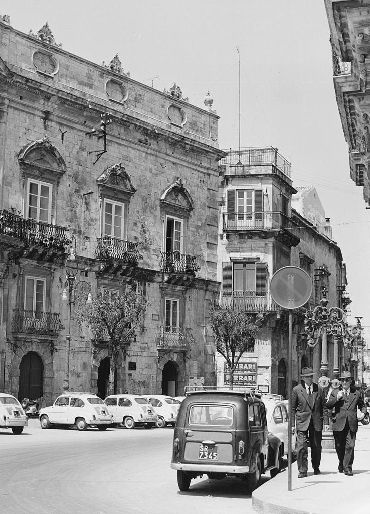 Grand old buildings in a street in Sicily, 1960s.