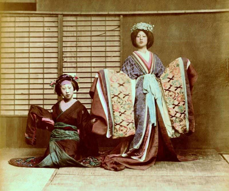 A couple of dancing girls taken in a 19th century Yokohama studio