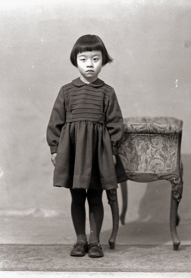 A young Japanese girl in a dress and flats