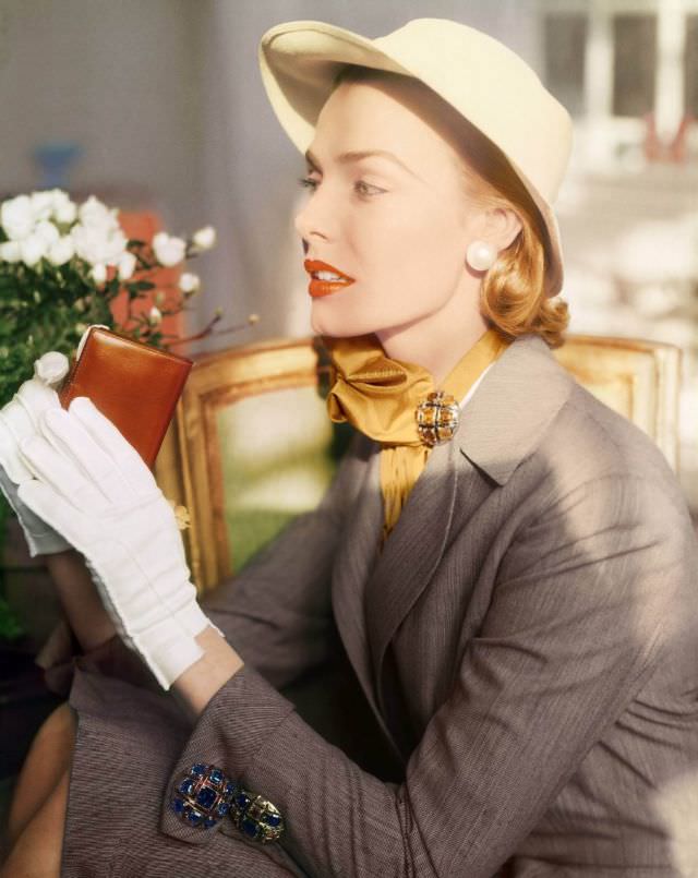 Lillian Marcuson wearing a hairline worsted suit, by Ben Frances Denney, jewelry on the cuff and scarf by Marcel Boucher, 1952