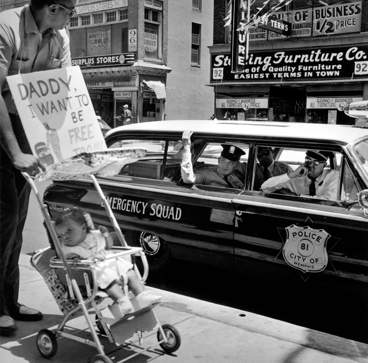William Edwin Jones pushes daughter Renee Andrewnetta Jones (8 months old) during protest, Main Street, Memphis, Tennessee, 1950s