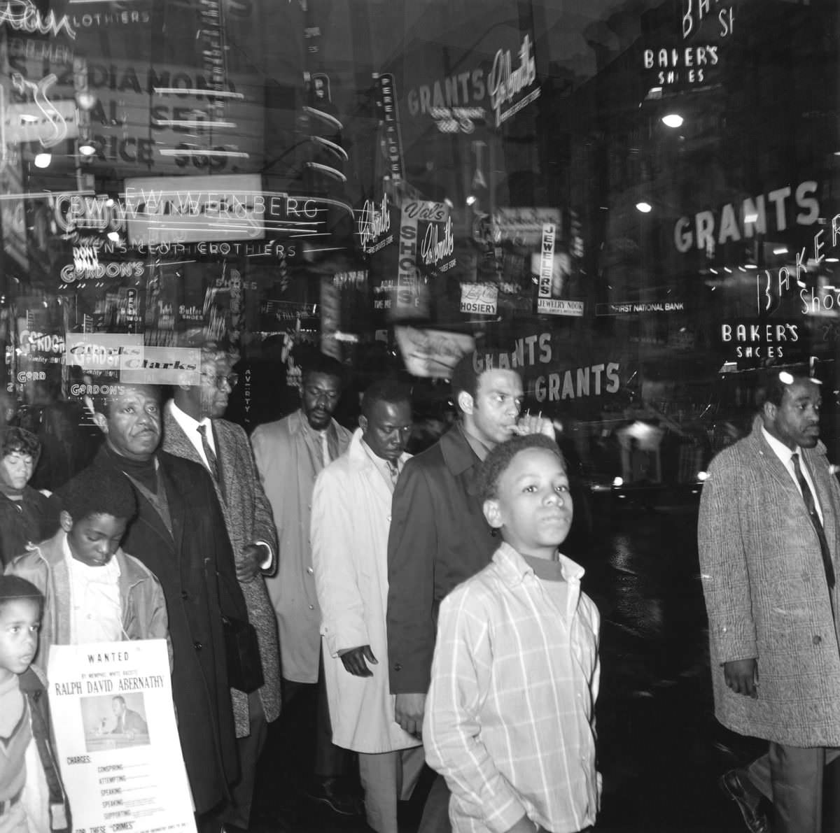 Double exposure of a nighttime march.