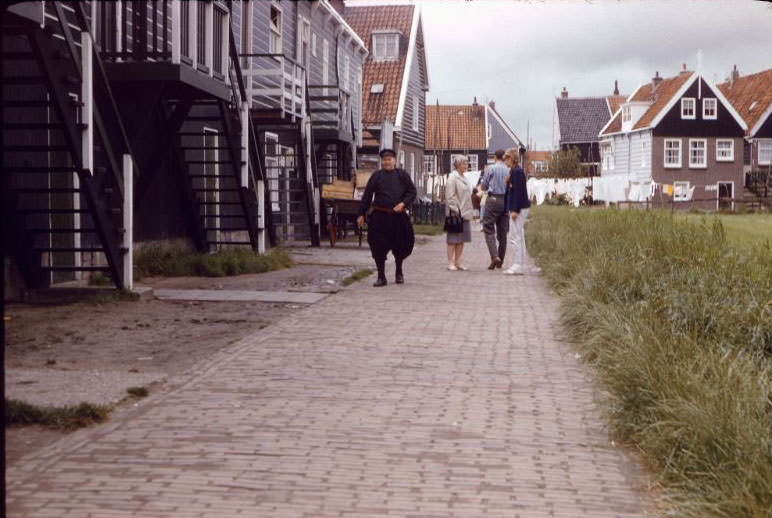 Dutch pedestrians on the street, Marken Island, 1961