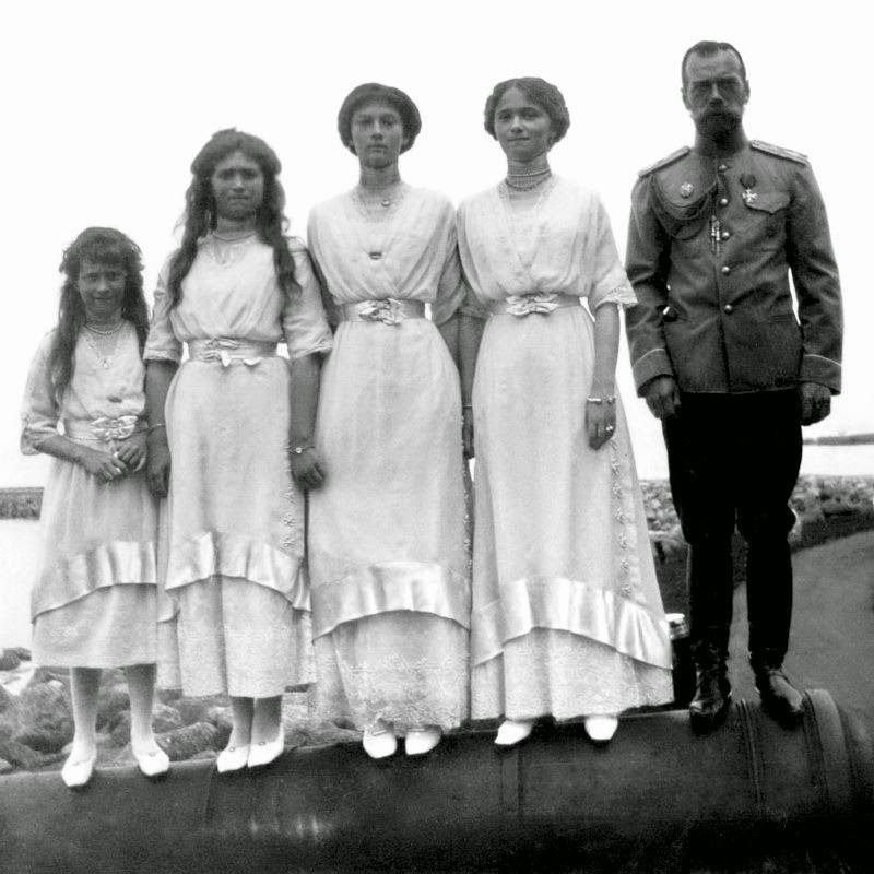 Tsar Nicolas II and his daughters on a cannon, .1910s.