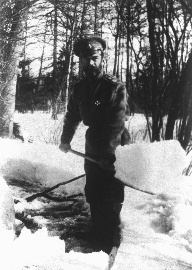 Czar Nicholas II of Russia shovels snow in the park at Tsarskoe Selo, Russina, where he and the royal family were interned in 1917.