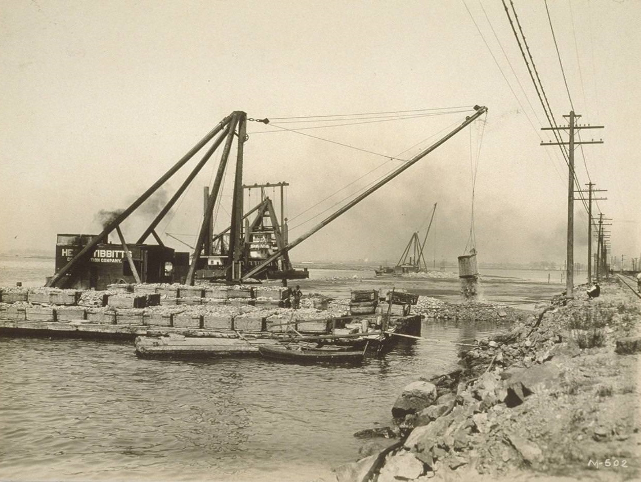 Dredging [and] dumping rock on bullshead wall, 6500 ft. long in ...