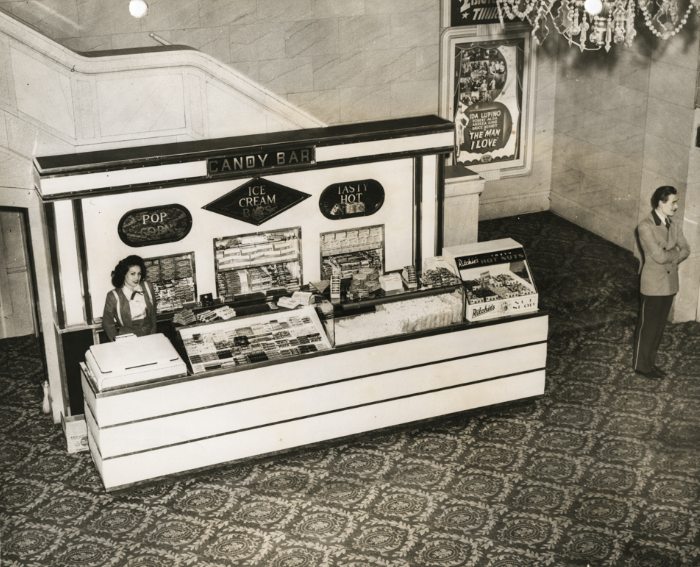 Interior of Fox Oakland Theatre in Oakland, California with candy bar attendant, 1940s