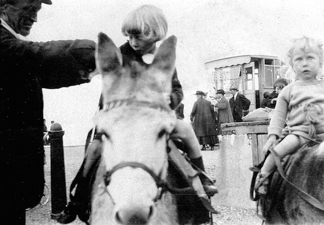 Historical Photos of People Enjoying Donkey Rides on the Beach from the Early 20th Century