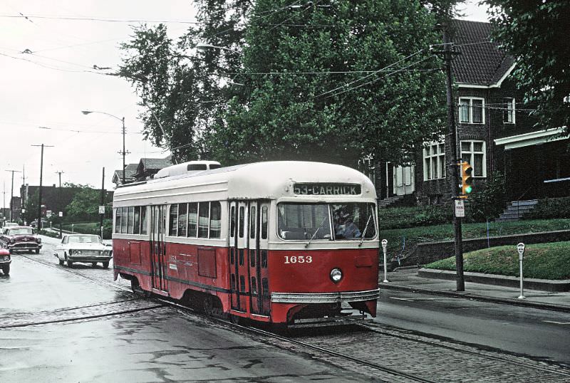 A #64 East Pittsburgh-Willkinsburg car on Forbs Ave. at Frick Park in Pittsburgh, PA on June 26, 1965