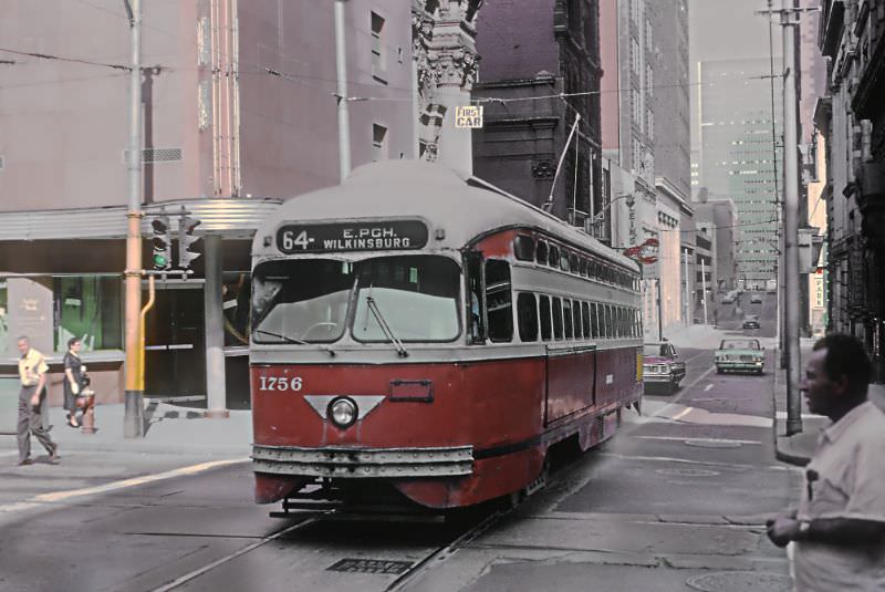 A #64 East Pittsburgh-Willkinsburgcar on 4th Ave. crossing Smithfield Street in downtown Pittsburgh, PA on June 27, 1965