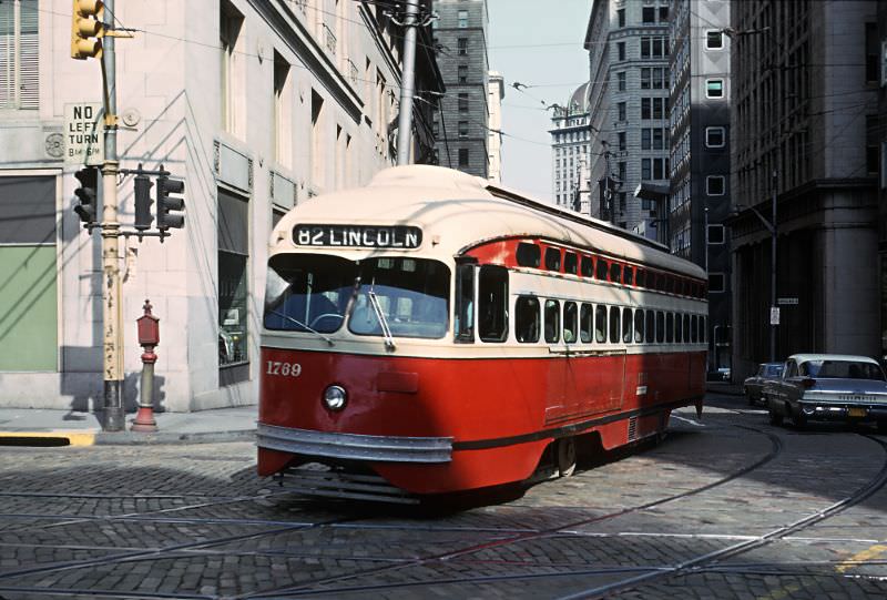 A #82 Lincoln car on 6th Ave. crossing Grant St. in downtown Pittsburgh, PA on June 27, 1965