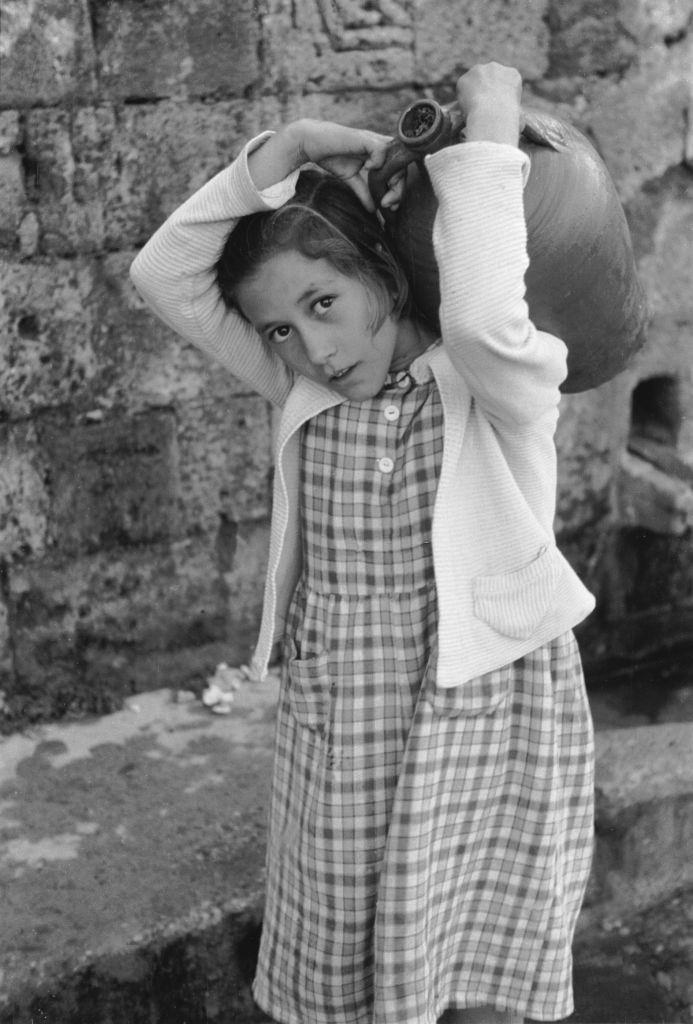 Girl from the village of Lindos in Rhodes with a jug, 1954.
