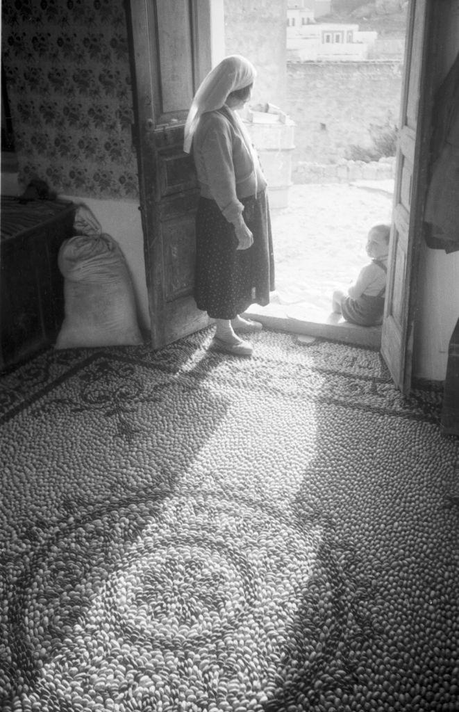 A woman in the hallway of her home in Rhodes, Greece, 1950s.