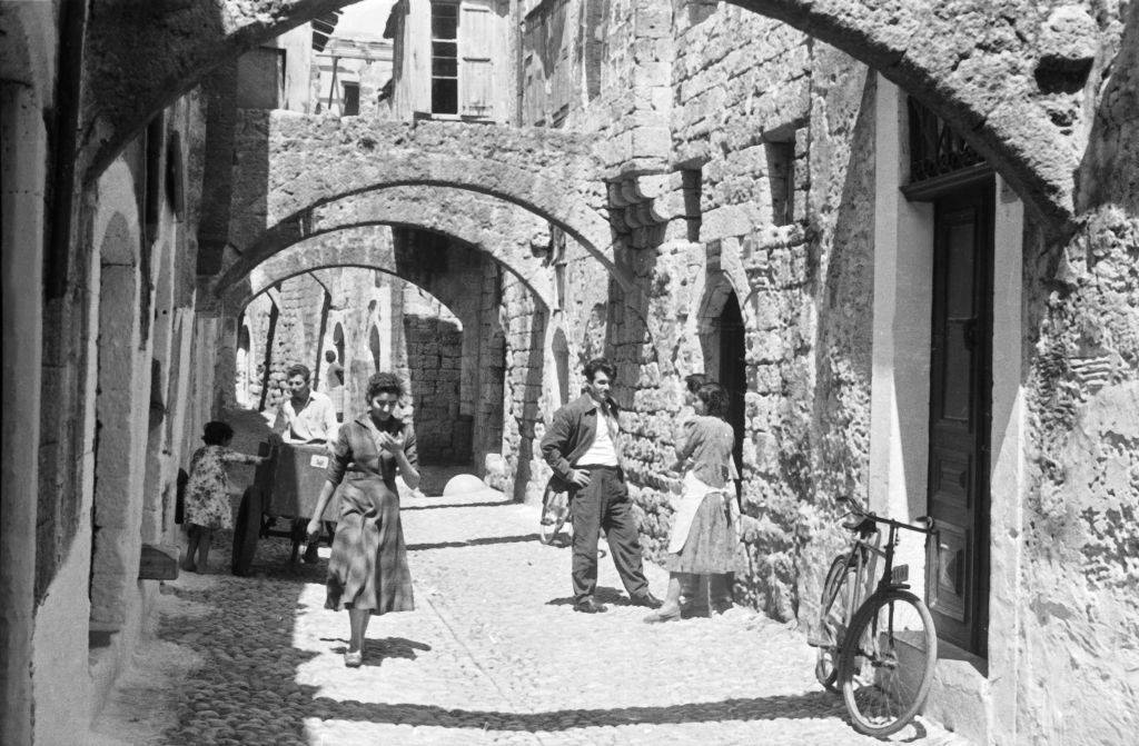 People in a small alley on Rhodes, Greece 1950s.