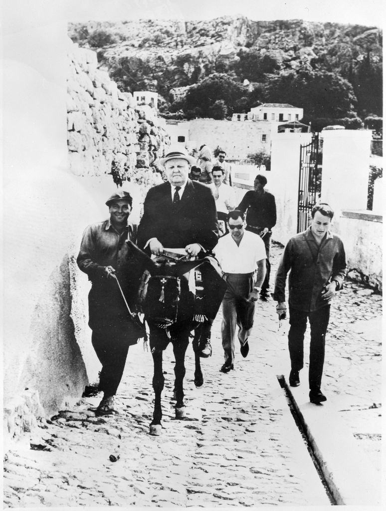 Ludwig Erhard riding a donkey in Rhodes 1962.