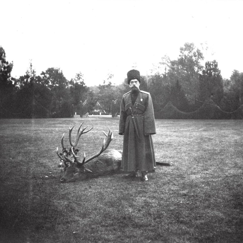 Tsar Nicholas II posing with a deer felled at Spala shortly before the crisis with his son began.