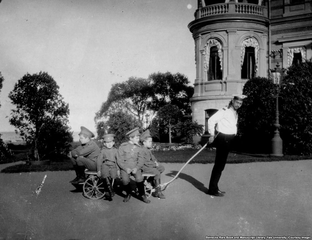 Klementy Nagorny (right) was also tasked with looking after Tsarevich Aleksei (second from right on trolley).