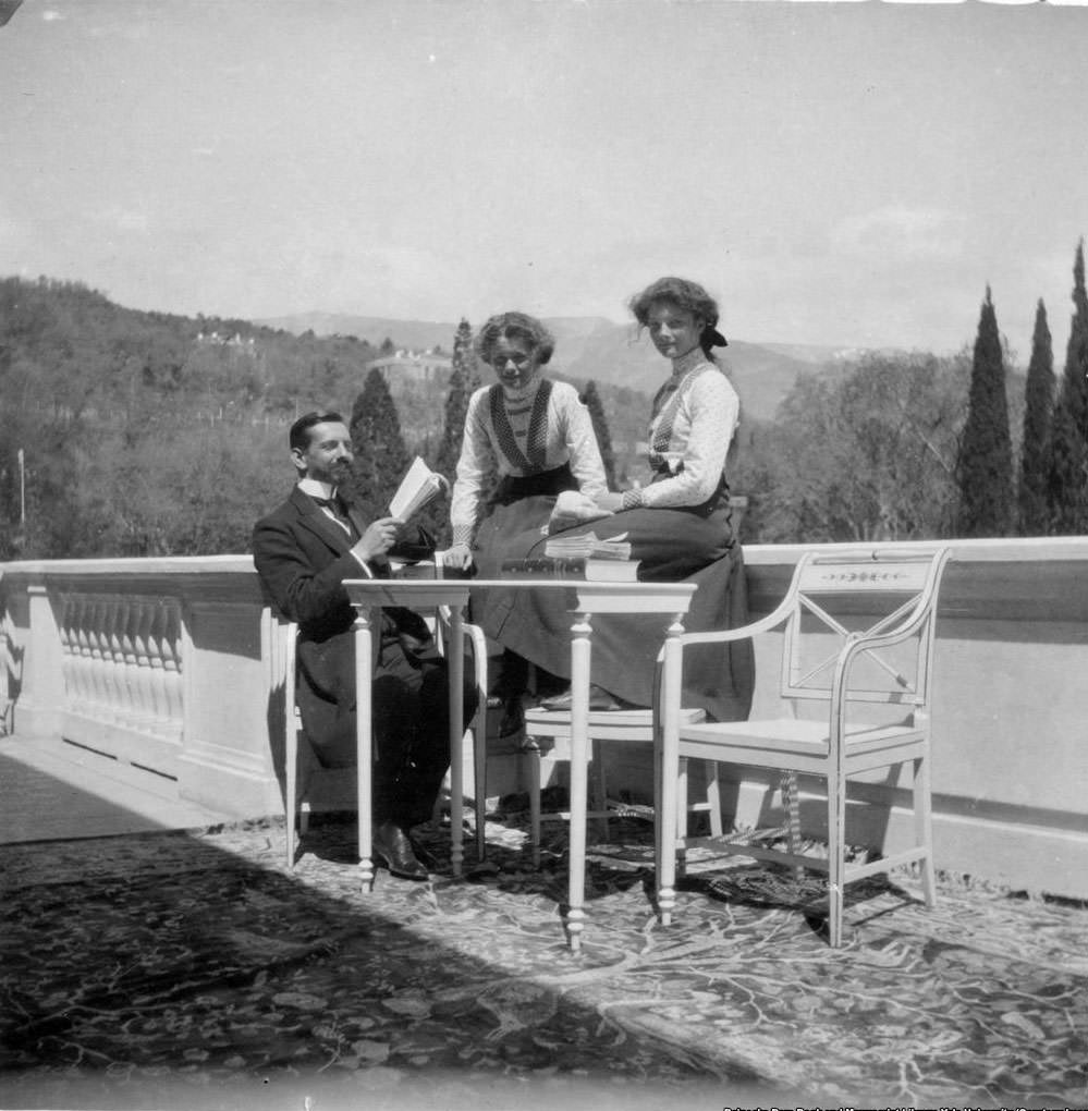 Pierre Gilliard, the family's French tutor, with his pupils Olga and Tatyana Romanov. Gilliard was another of the family's retinue who joined them in captivity.