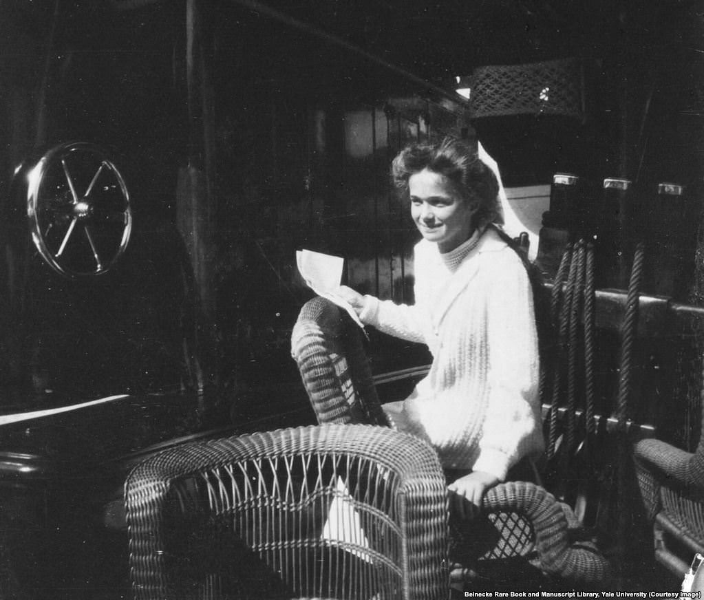Olga Romanov in a wicker chair aboard the Standart.