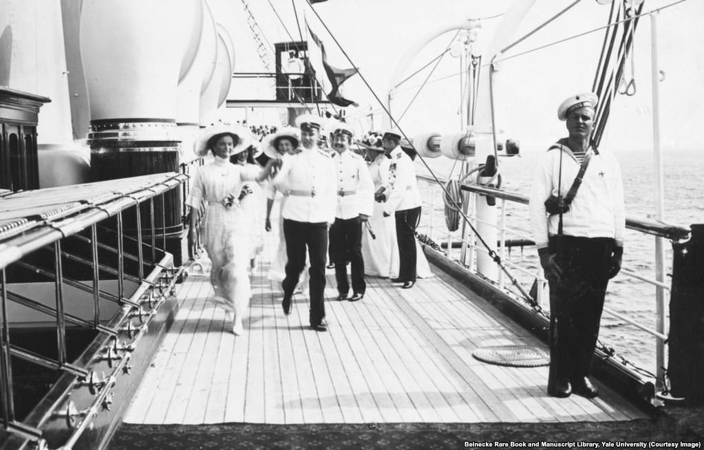 The grand duchesses striding across the deck of the Standart.