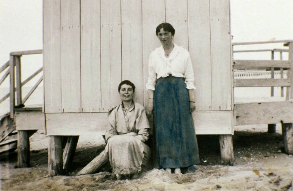 An unidentified woman and Olga Romanov (at right)