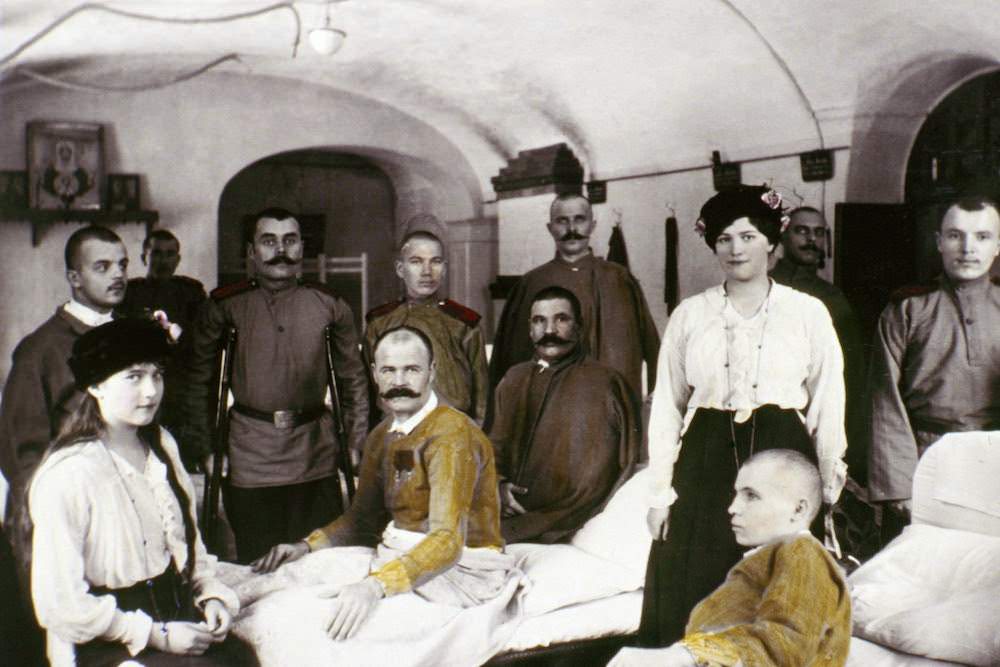 Anastasia (at left) and Maria visit wounded WWI soldiers in hospital.