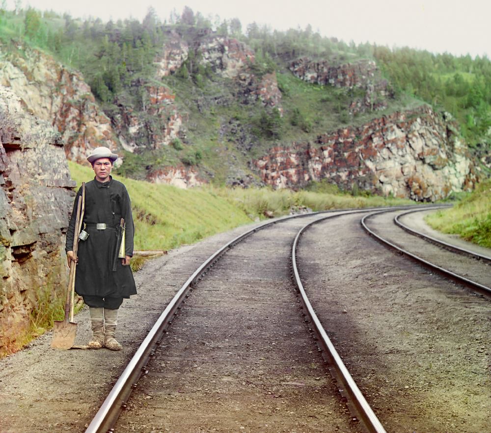 A switch operator poses on the Trans-Siberian Railroad, near the town of Ust Katav on the Yuryuzan River in 1910.