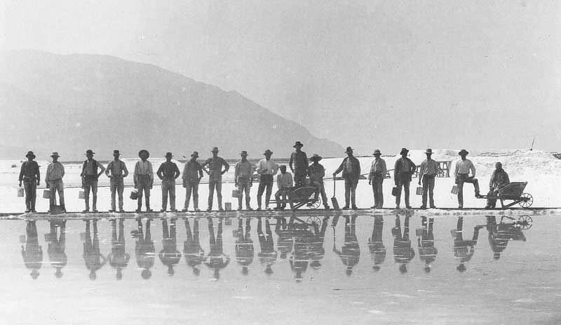 On the Great Salt Lake, salt harvesters line up.