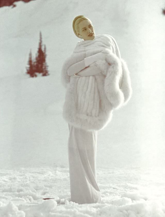Lily Carlson wearing long white stole of Russian ermine and Russian fox, Vogue, August 1946