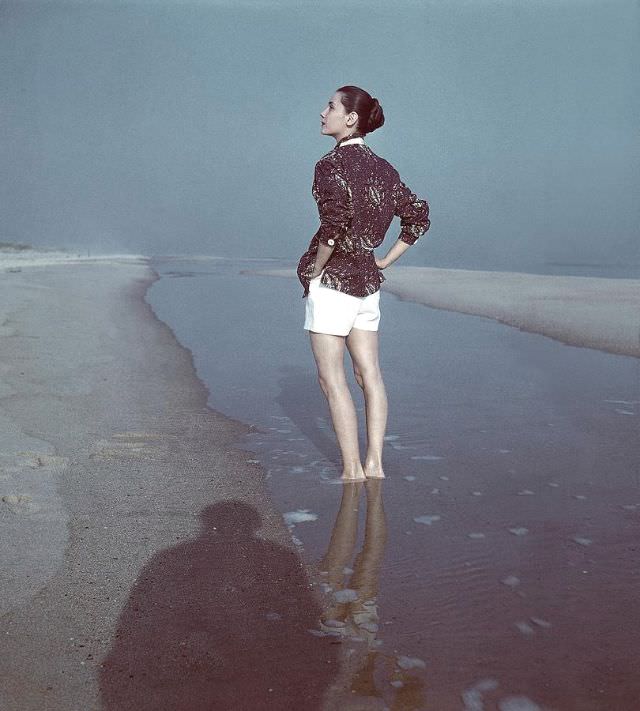 Model is wearing batik printed shirt over white shorts, 1946