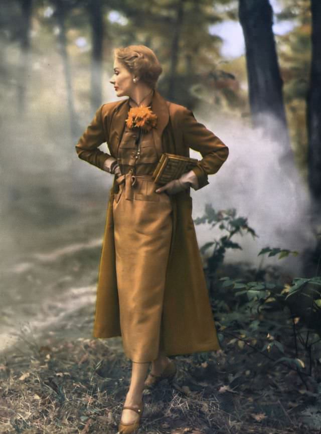 Lisa Fonssagrives in two tones of copper shantung, lighter tone dress and darker tone duster coat from Vogue Couturier Pattern no.477, Vogue, January 1949
