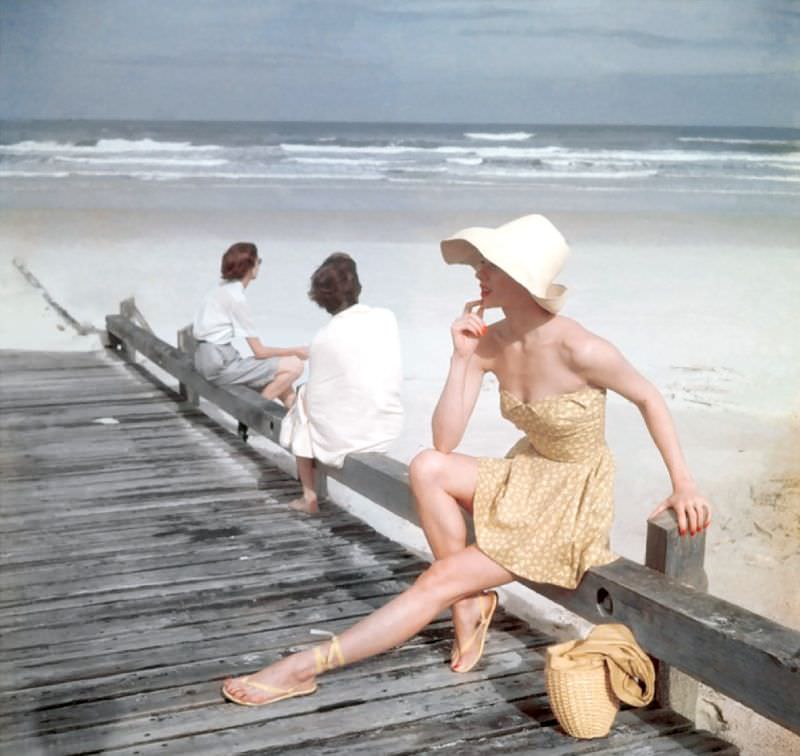 Model in yellow petal-top beachwear, Vogue, 1949